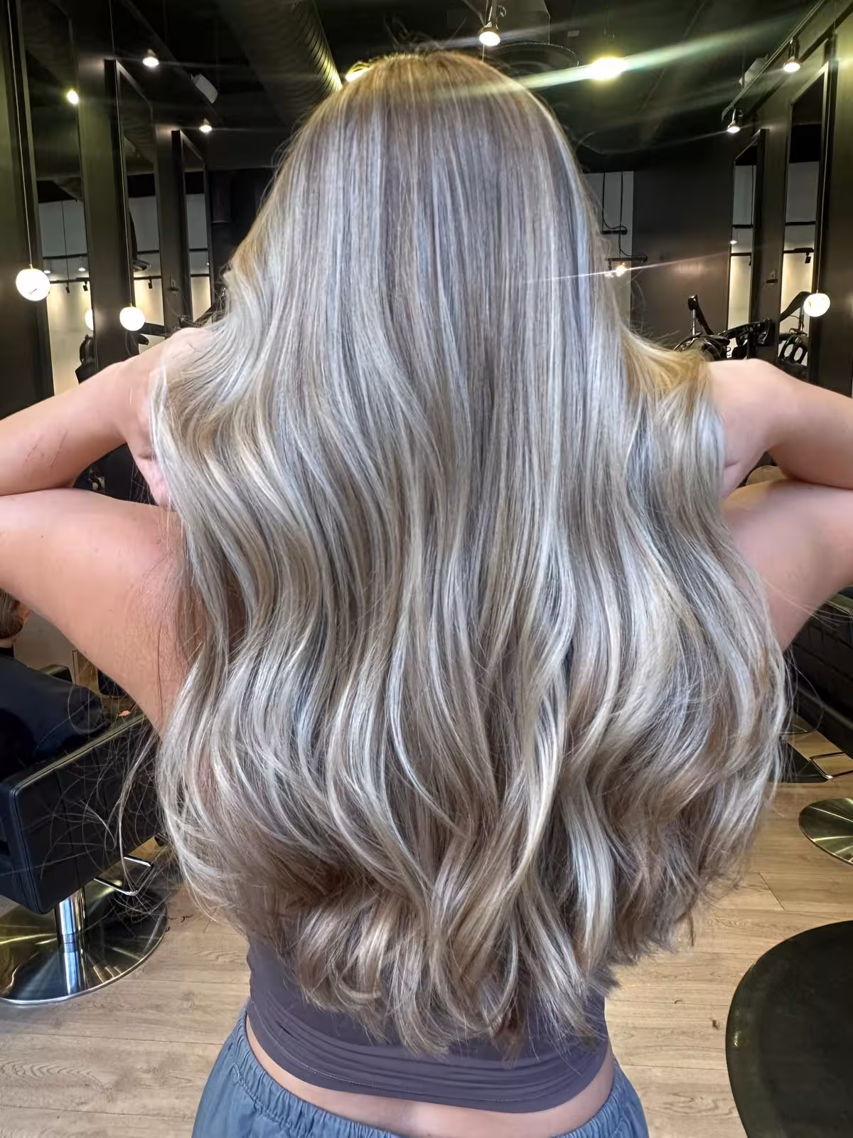Long silver-blonde balayage with soft waves, back view - blonde hair color Honolulu